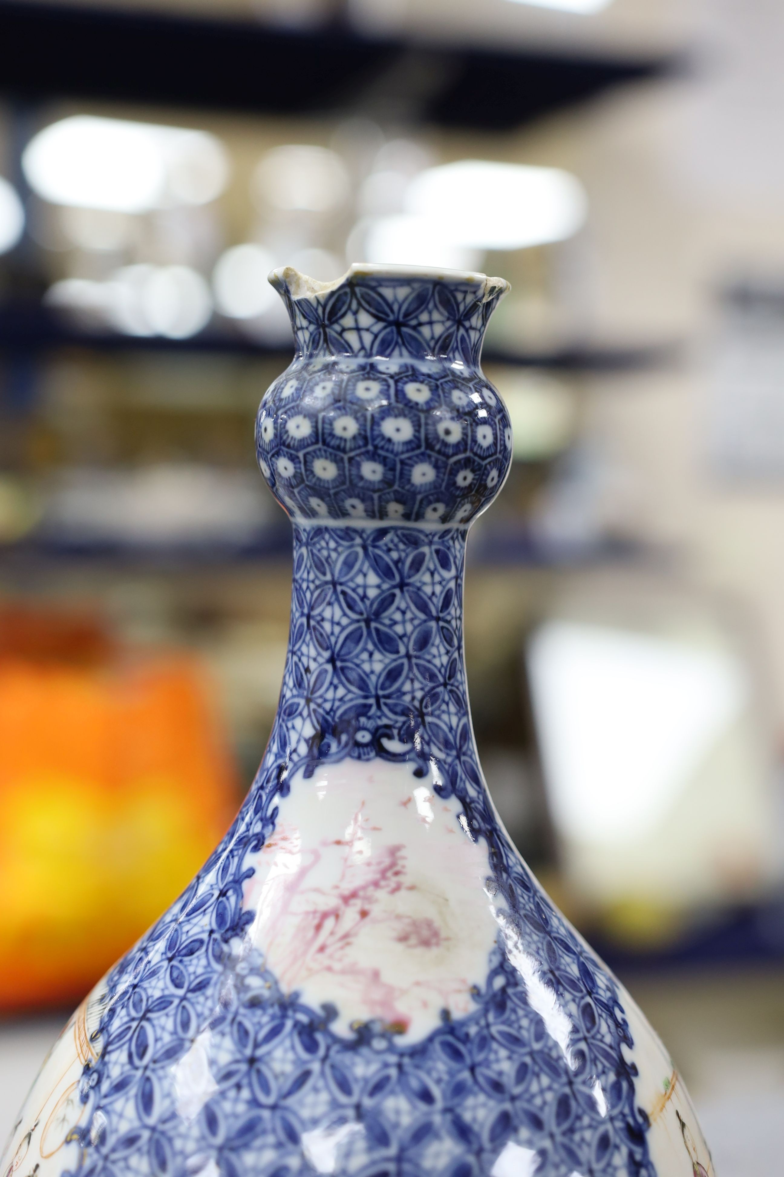 A pair Samson of Paris vases in the Chinese famille verte style and a Chinese Qianlong famille rose garlic neck vase with blue panelling motif, tallest 26cm